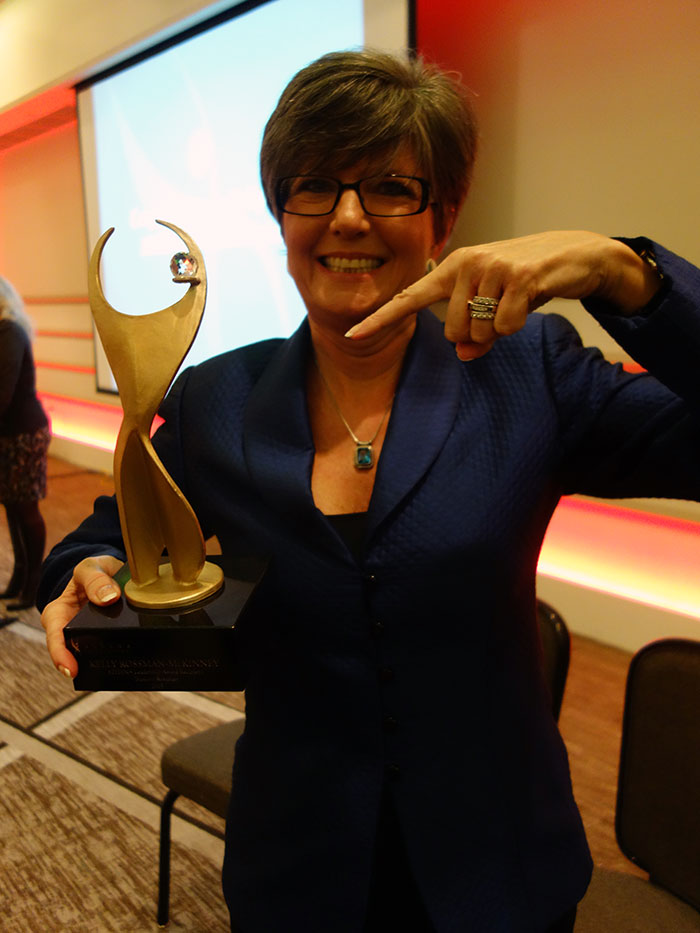 Kelly Rossman-McKinney with the 2013 ATHENA Award